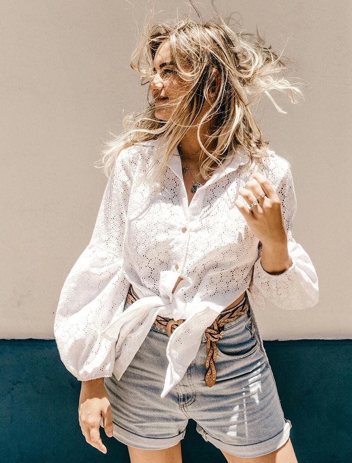 Woman in white dress on beach